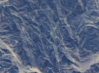 Buruşmuş kağıt dokusu fotoğrafı. Soyut kağıt arkaplanı.