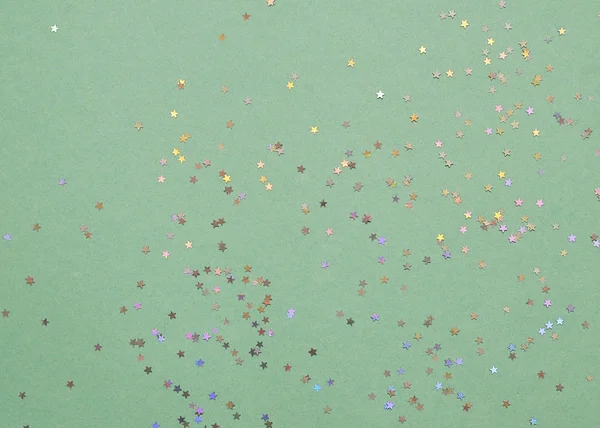 Festlig Bakgrund Färgglada Glitter Stjärnor Mint Färg Bakgrund — Stockfoto