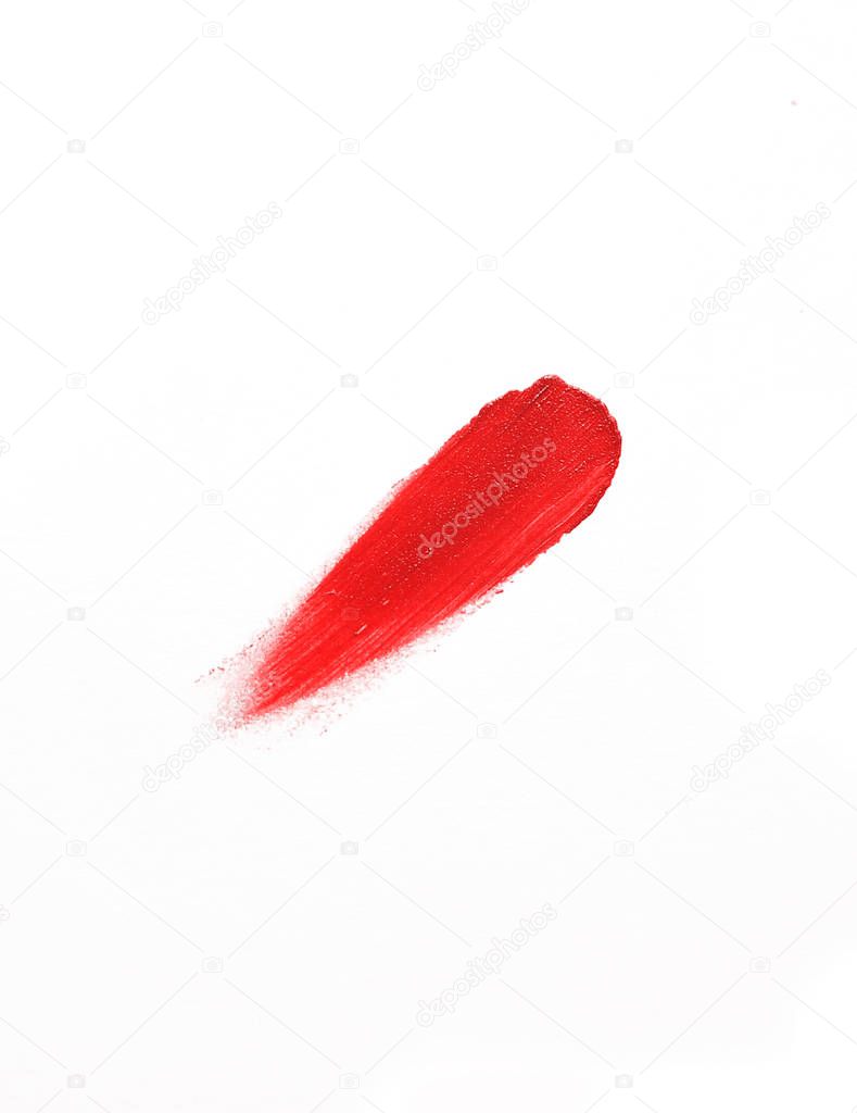 Photo of lipstick smear texture on white background.