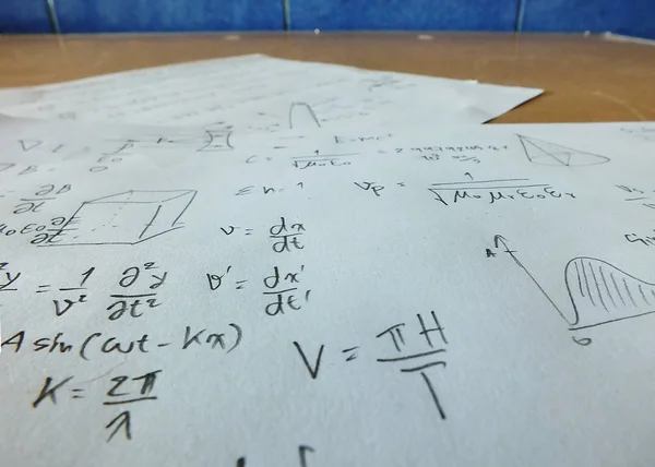 Close up mathematical equations on a sheet of paper