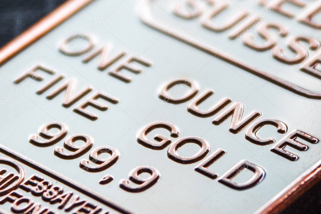 the small  gold bar is one ounce.