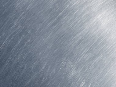 Paslanmaz çelik dokusu ile dairesel çizik.