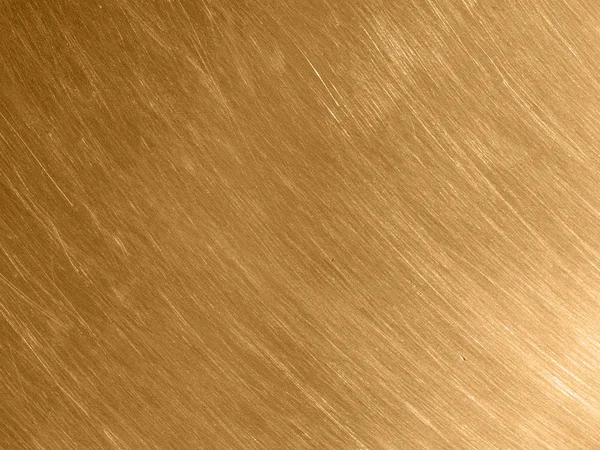 Dairesel çizik ile altın metal doku.