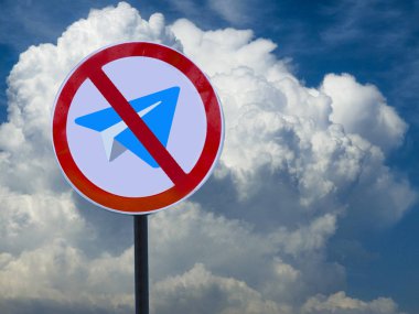 Road sign crossed out plane against the sky with clouds. Stop telegram. clipart