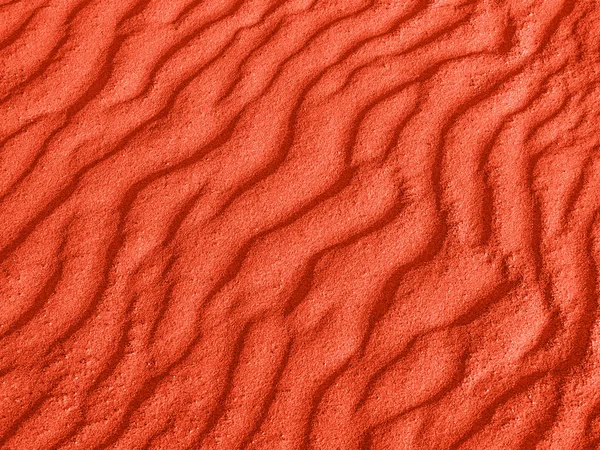 沙滩上或沙漠中的红沙波浪的纹理。沙子的涟漪是对角的. — 图库照片