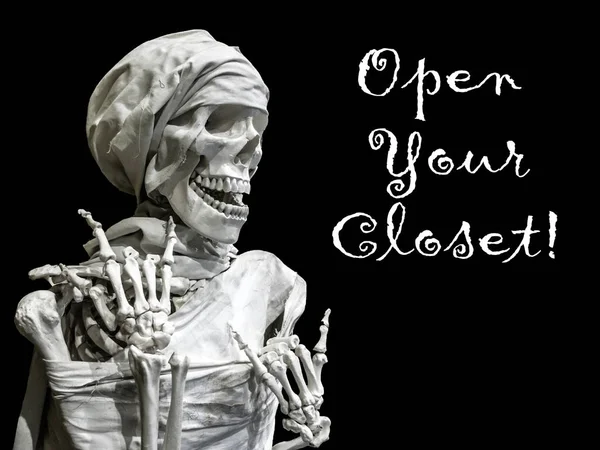 Skeleton model of the man with the inscription Open your closet. — Stock Image Skeleton model of the man with the inscription Open your closet. Royalty Free Stock Images