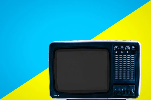 The Soviet analog retro TV on blue ad yellow background — Stock Photo, Image