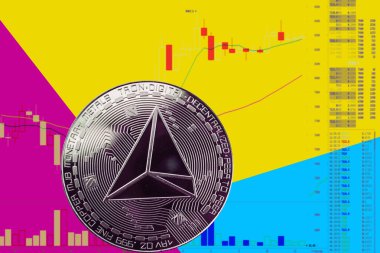 Sikke cryptocurrency trx grafik ve sarı mavi neon arka plan.