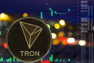 Cryptocurrency Tron Trx gece şehir arka plan ve grafik üzerinde sikke.