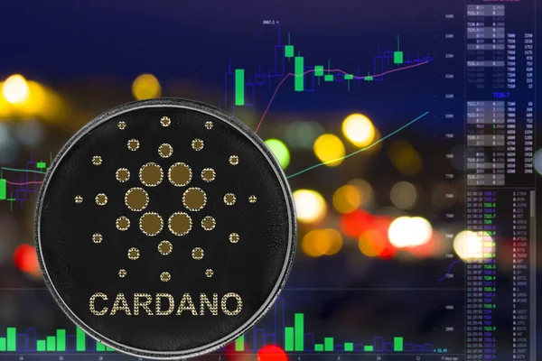 Sikke cryptocurrency Cardano Ada gece şehir arka plan ve grafik.