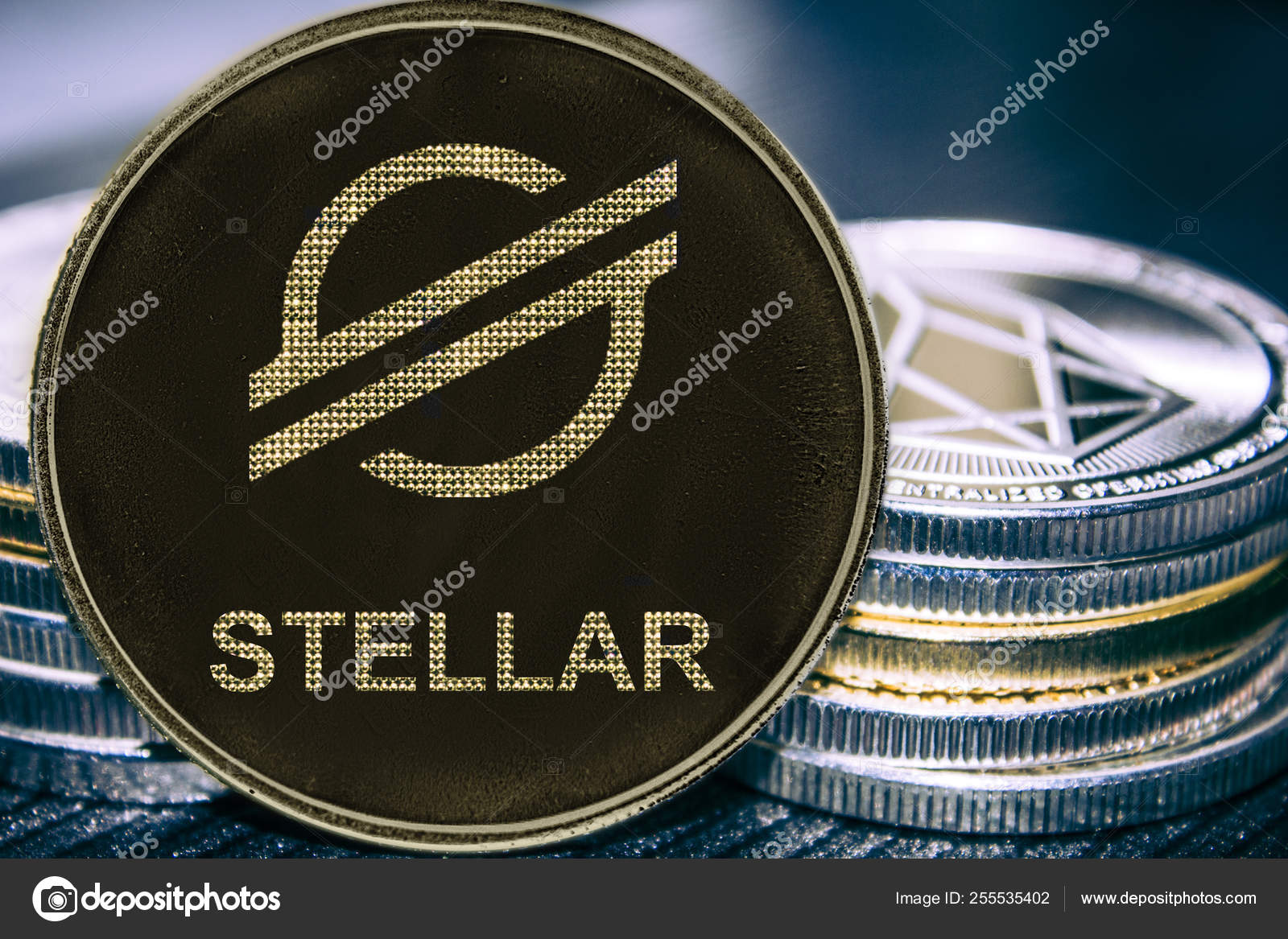 New token cryptocurrency Stellar XLM on the background of a stack of coins.  — Stock Photo © shahurin #255535402