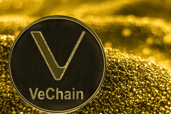 Altın arka planda sikke kripto para birimi Vechain Vet.