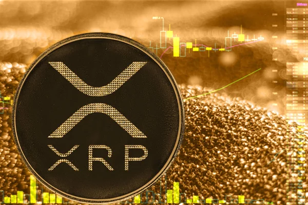 Coin cryptocurrency xrp ripple on golden chart. — Stock Photo, Image