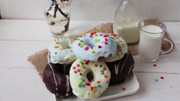 Donuts Com Leite Fundo Branco Flores Azuis Copo Ramo Sakura — Vídeo de Stock