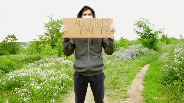 Young Man Mask Cardboard Poster His Hands Inscription All Lifes — Stock Video