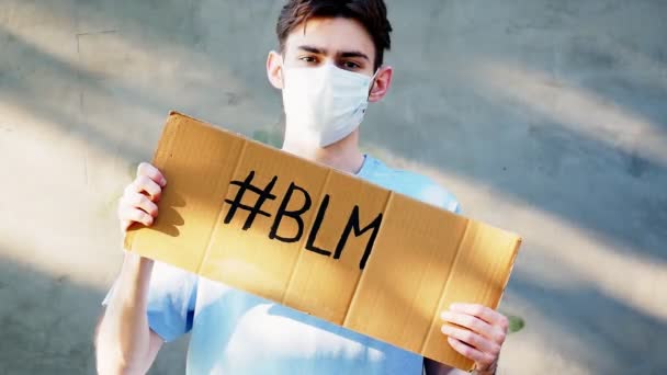 Young Man Cardboard Poster His Hands Inscription Blm Single Protest — Stock Video