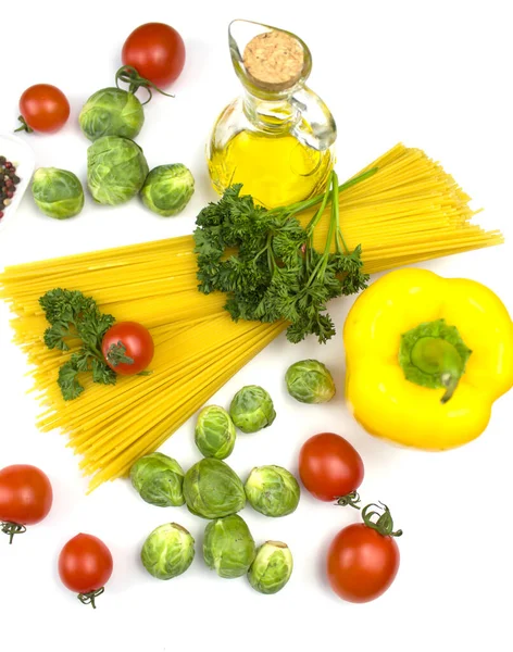 Italian food. Italian pasta with tomatoes and herbs. Italian food, food ingredients. Olive oil. View from above. Isolate Copyspace