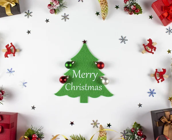 Flatley Christmas. Holiday Christmas background. New Year\'s and Christmas. Christmas tree background with gifts. Merry christmas inscription. View from above.