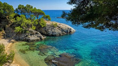 Tourist's dream. The panorama of the paradisiacal coast mediterranean in Platja d'Aro, Costa Brava, Spain.                 