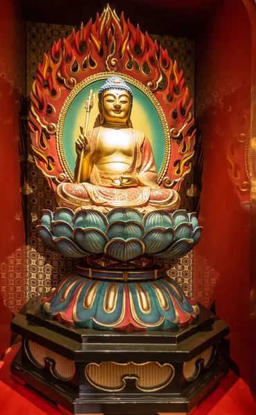 Fire Sermon Buddha with khakkhara at Buddha Tooth Relic Temple, — Stock Photo, Image