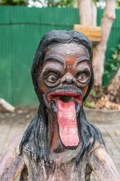 Closeup, Woman with long tongue at Garden of Hell at Wang Saen S — Stock Photo, Image