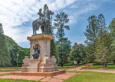 Bangalore, Karnataka, India - October 5, 2013: Lal Bagh Botanical Garden. Statue of Sri Chamarajendra Wodeyar, ex-ruler of Mysore. Here he sits on his horse, Justice statue built in niche on the pedestal