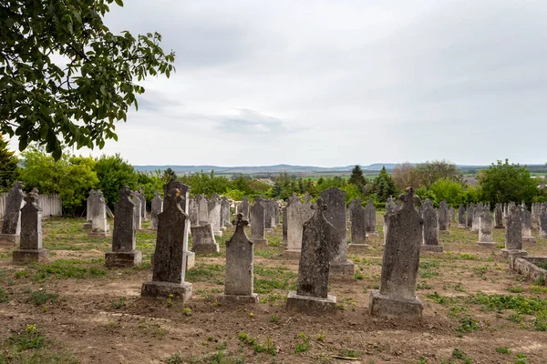 Zsambek, Hungary - 05 10 2020: Old cemetery in Zsambek, Hungary on a cloudy spring day.