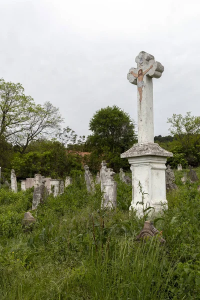 Zsambek, Hungary - 05 10 2020: Old cemetery in Zsambek, Hungary on a cloudy spring day.