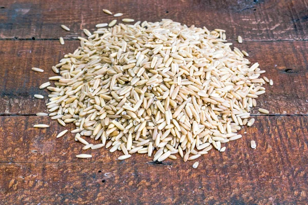 rolled oat, oat flakes photo, wooden background.