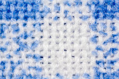 mavi ve beyaz örgü kumaş yakın