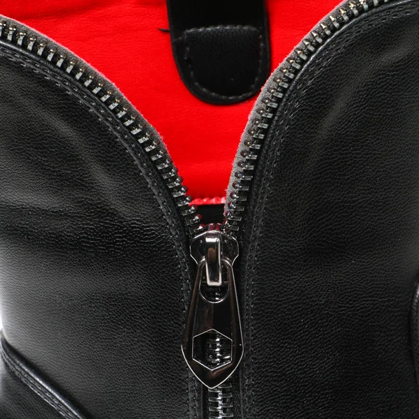 Parts of footwear on a white background. Detail shoes with carved elements-laces, sole, fasteners, fur.