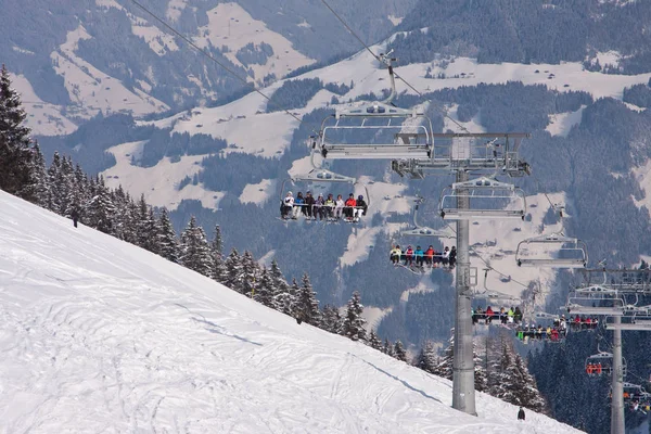 Skiers on skilift with frost trees montains. Ski resort in Europe — Stock Photo, Image