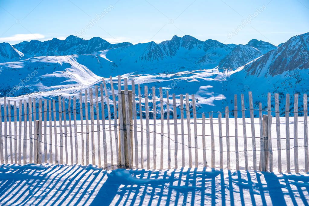 Andorra GrandValira Ski. Pyrenees Mountains. wooden fence in the mountains