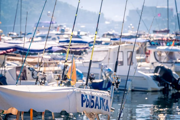 boat with fishing and rental services with spinning rods ready for fishing, Budva, Montenegro