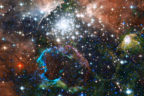 Beautiful nebula and bright stars in outer space, glowing mysterious universe.