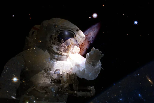 Astronaut in deep space. Elements of this image furnished by NASA