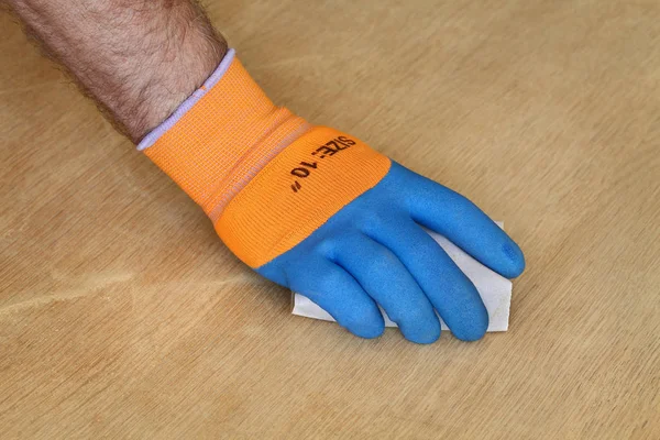 Closeup Worker Hand Protective Glove Sanding Wooden Plank — Stock Photo, Image