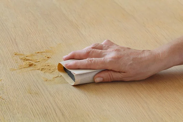 Closeup Worker Hand Sanding Wooden Plank — Stock Photo, Image