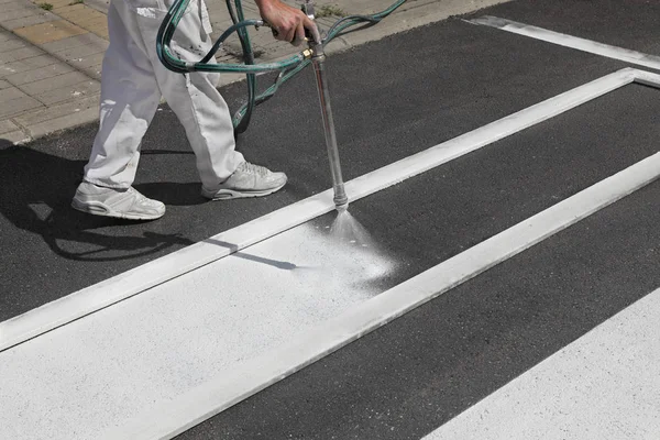 Worker Spraying Pedestrian Crosswalk Street — Stock Photo, Image