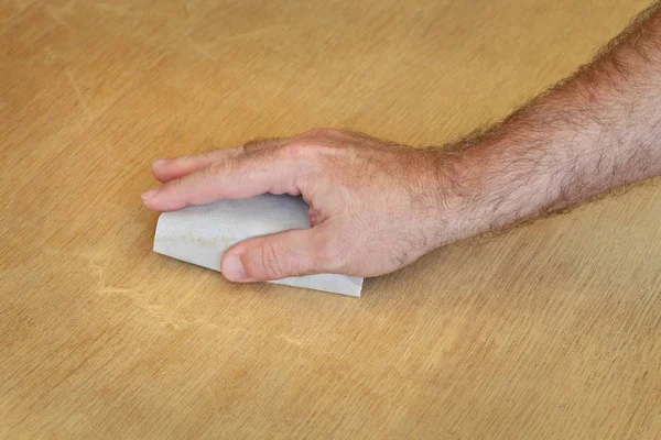 Closeup Worker Hand Sanding Wooden Plank — Stock Photo, Image