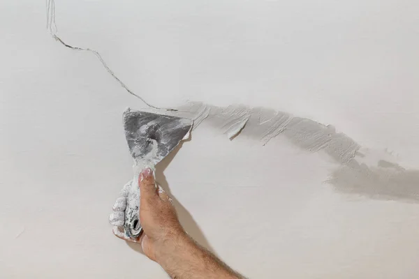 Worker Fixing Cracks Ceiling Spreading Plaster Trowel Selective Focus — Stock Photo, Image