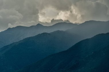 Storm clouds over the mountains. Kerkini Mountains. Greece clipart