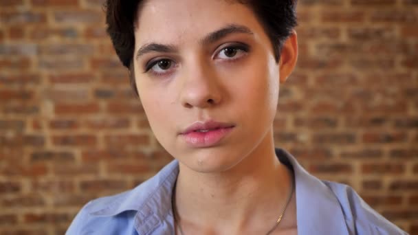 Young Beautiful Short Hair Girl Is Watching At Camera Smiling