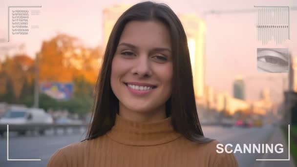 Futuristic and technological scanning of the face of a beautiful woman for facial recognition and scanned person — Stock Video