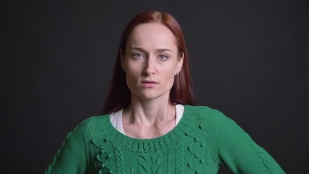 Closeup portrait of attractive caucasian female being angry frustrated and waving with her finger looking at camera — Stock Video