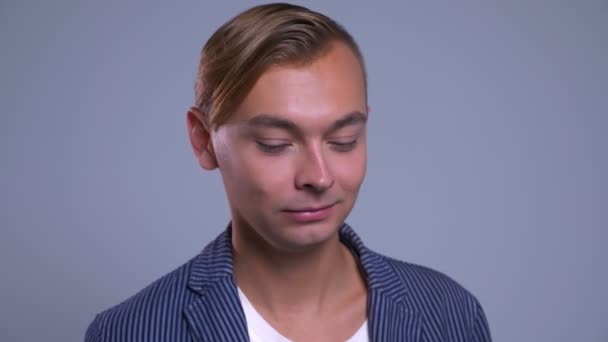 Closeup portrait of cynic young caucasian man looking at camera having no idea — Stock Video