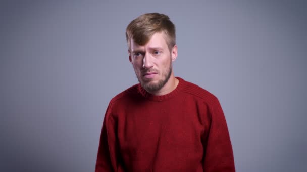 Closeup portrait of adult disappointed caucasian man being upset and having arms crossed on chest. — Stock Video