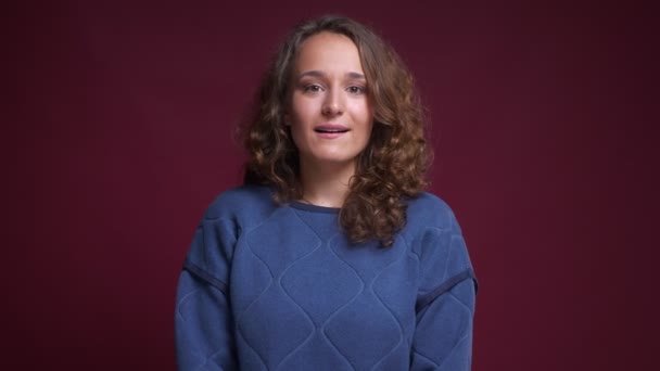 Closeup portrait of hopeful young caucasian female having her fingers crossed anxiously and praising — Stock Video