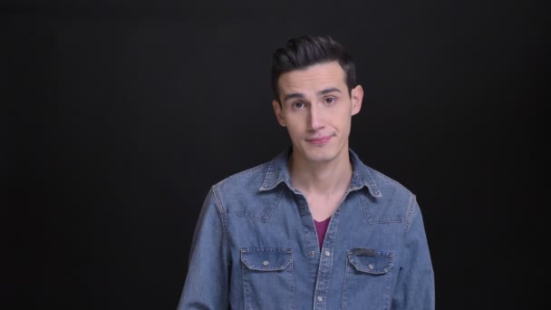 Closeup portrait of young caucasian man being unsatisfied and waving his head in sign of rejection — Stock Video