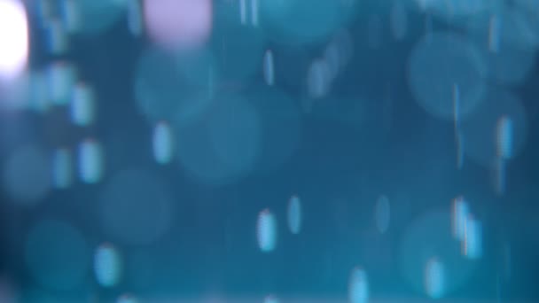 Closeup tiro de belas luzes azuis bolhas e fundo bokeh — Vídeo de Stock